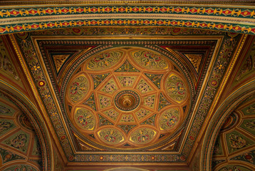 Ceiling at royal era historic Manasterly Palace decorated with colorful and golden floral paintings, Cairo, Egypt