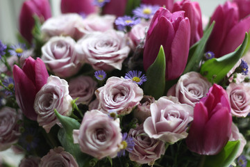 Bouquet of pink roses and tulips stock photo. Gift cards. Beautiful background flowers, roses and tulips. Greeting card, decoration for party.