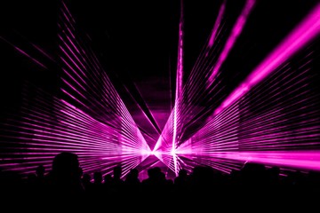 Pink laser show nightlife club stage with party people crowd. Luxury entertainment with audience...