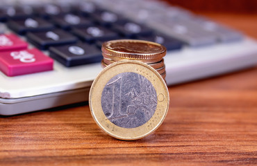 One euro close up on calculator background