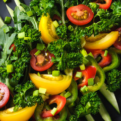 a fresh chopped vegetable salad closeup,view from above, background