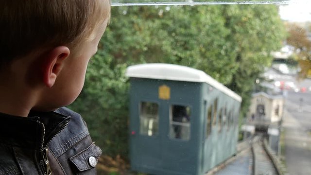 young boy in the funicular of Pau city