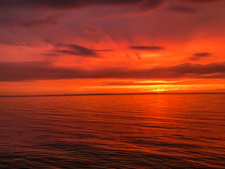Red orange fire sunset at the sea