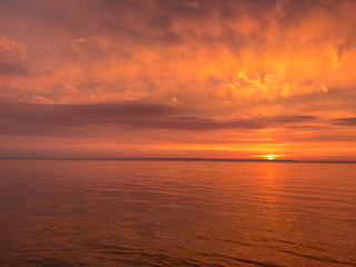 Red orange fire sunset at the sea