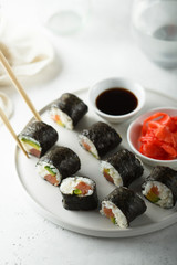 Fototapeta na wymiar Homemade maki sushi with salmon
