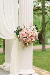 Decor with flower columns for the wedding ceremony. Festive decor.