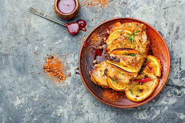 Glazed roast pork meat in orange