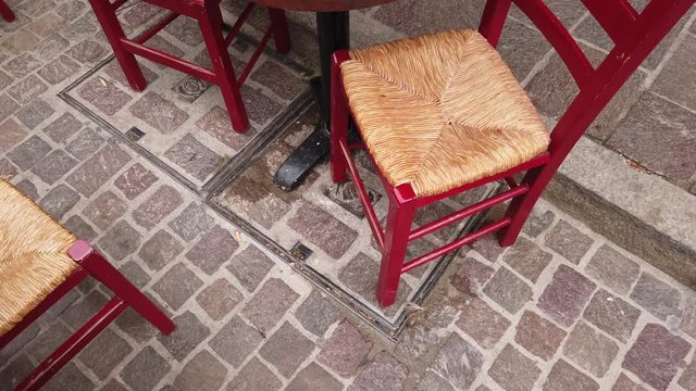 Close top view on tables and chairs of an outdoor cafe.