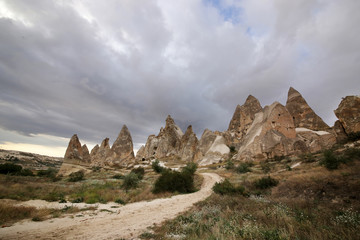 Fototapeta na wymiar Unusually shaped volcanic rocks near the village of Goreme in the Cappadocia region of Turkey.