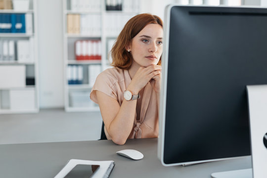 Serious Businesswoman Concentrating On Her Work