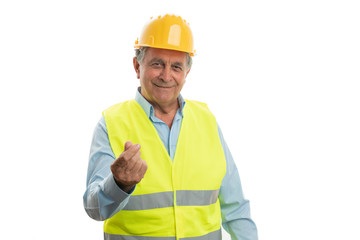 Builder showing money gesture with fingers