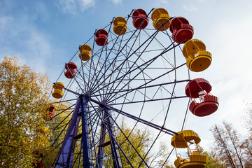 Ferris wheel in Kirov. Modern attraction. Blue construction. Cloudy weather.