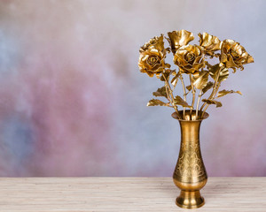 golden roses made of metal as symbol of eternal love