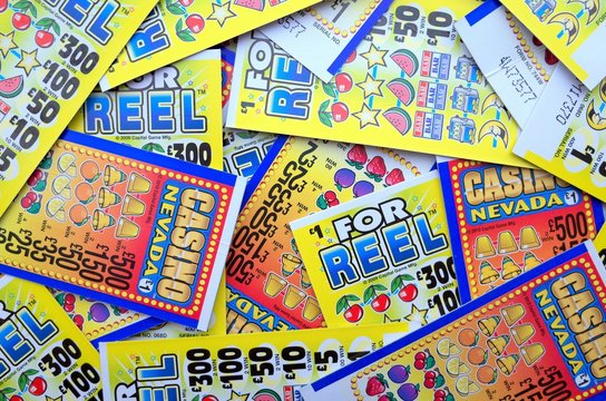 Random selection of lottery scratch cards for cash prizes to be won in British Pounds. Photographed on February 14, 2018 in England