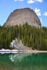 The Beehive mountain range reflects onto Mirror Lake.