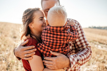 Happy Young Family Mom and Dad with Their Little Son Enjoying Summer Weekend Picnic Outside the...