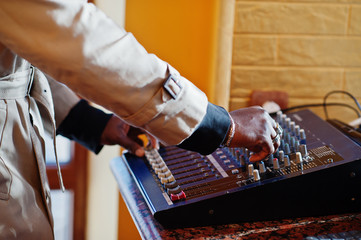 African american young sound producer working at studio.