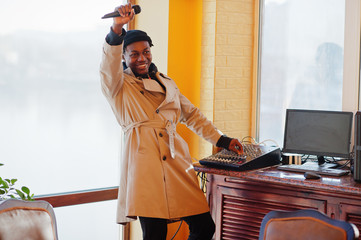 African american young sound producer working at studio.