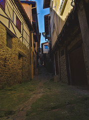 Narrow and somber street of Miranda del Castañar.