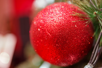 Large red ball on a Christmas tree close-up