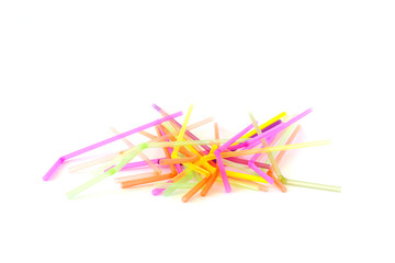 Colorful plastic drinking straws isolated on a white background. Top view.