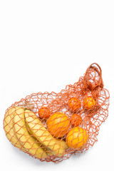 Zero waste,plastic free .Fresh fruit oranges, bananas, and orange juice in a rag bag, the idea of ecology and earth care
