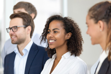 Multiethnic smiling team stand in row making group picture