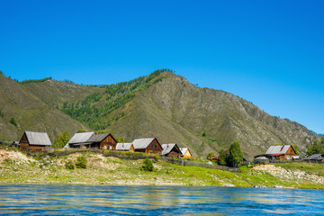 Old believers village on the siberian river Small Yenisei bank.