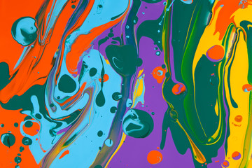 Colored acrylic paints mixed together for an abstract background.