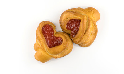 filled buns in the shape of a heart, on a white background