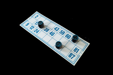 Blanching card lotto with blue number on black background