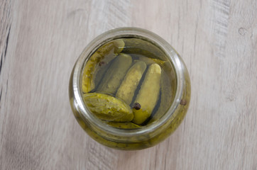 jar of pickled cucumbers on a white background. Homemade pickles. Close-up.