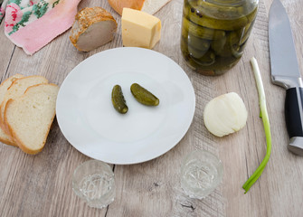 Cold Ukrainian grills with appetizers on a wooden table.
