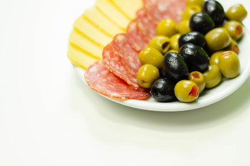 Set green and black olives with salami and cheddar cheese