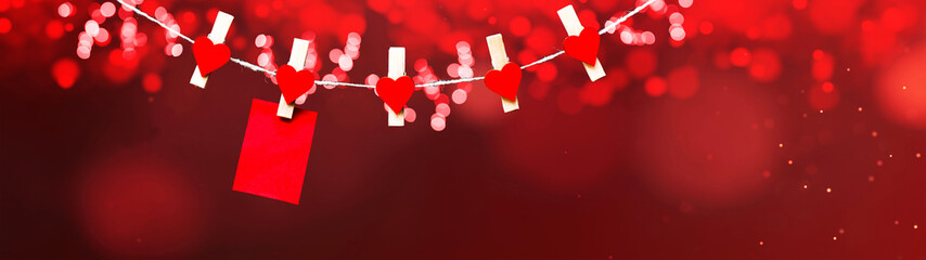 Happy Valentine's Day background banner panorama - Red paper note hang on wooden clothes pegs with...