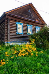 Old wooden log house in a russian village