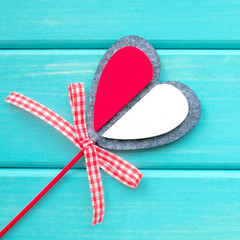 Decorative heart for Valentine's Day. Turquoise background.
