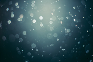 Abstract bokeh with a blue background, blurred background