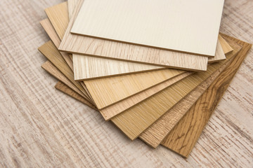 color sample boards for design on wooden desk.