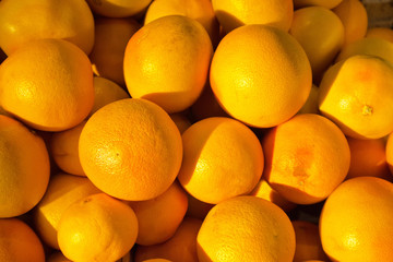 Fruit background from orange grapefruits. Vitamin Healthy Citrus Fruits. Flat lay, close-up, top...