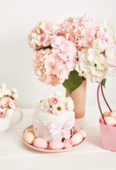 Easter orthodox sweet bread, kulich and colorful eggs with flowers. Holidays breakfast concept with copy space. Retro style. Easter greeting card template