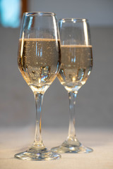 Two glasses of champagne in white background