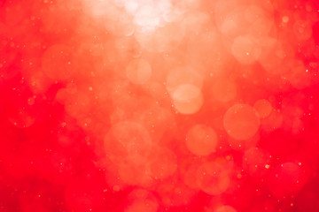 Abstract red background with blurred light bokeh