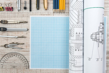 Technical drawing with millimeter paper and drawing tools. Mathematics and engineering