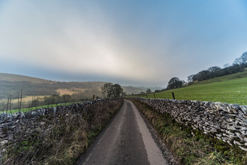 Road down the hills through the fields