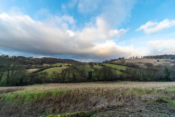 panorama of hills under clouds