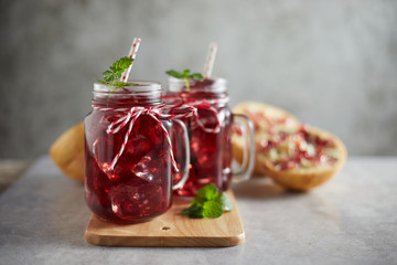 Pomegranate juice in jar with handle. .