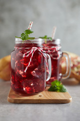 Pomegranate juice in jar with handle. .