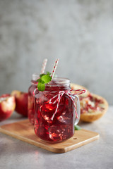 Pomegranate juice in jar with handle. .