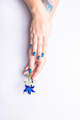 Stylish women's manicure on a gray background. 